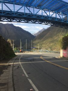 The last pedal stroke into Marcapata under the bridge connecting two parts of town